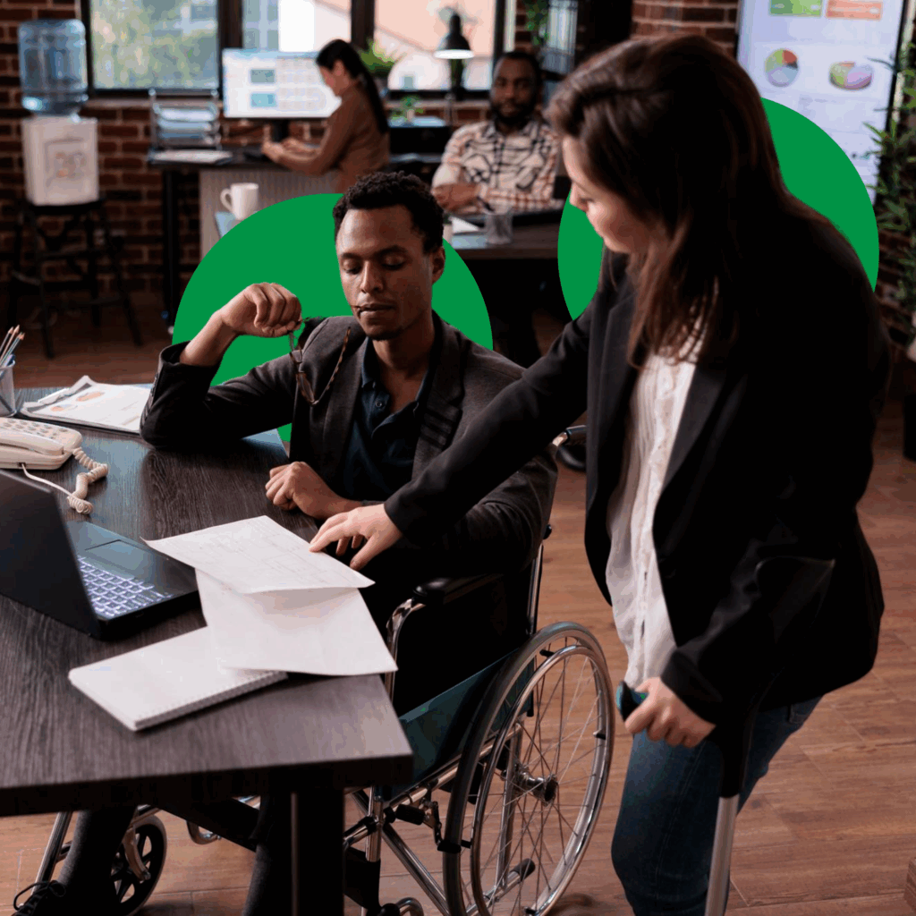 a man in a wheelchair looking at a woman